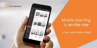 Person holding mobile phone with OpenSesame courses on it